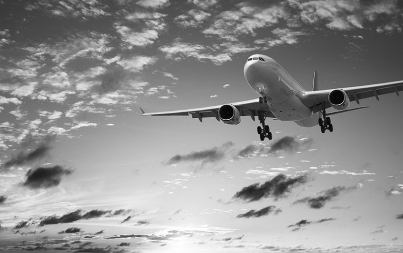 Jet plane in a sunset sky. Panoramic composition in high resolut Jet plane in a sunset sky. Panoramic composition in high resolution.